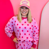 Tan hat with pink “Motherhood” embroidery, pink plaid brim, and rope detail snapback