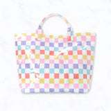 Multicolor checkered glossy tote bag in purple, yellow, pink, blue, and red.
