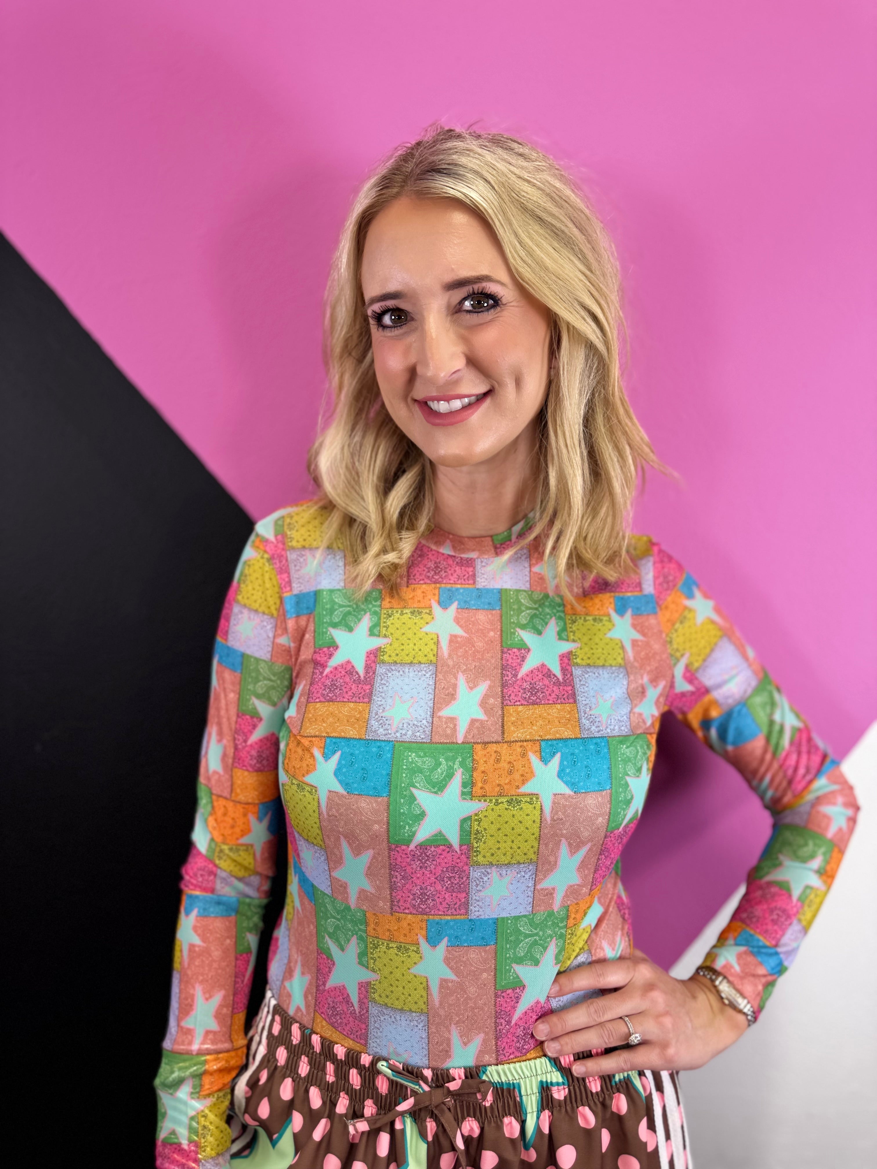 Sheer multicolor mesh top with patchwork stars, paisley print, and long sleeves.
