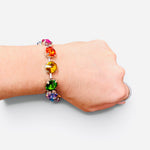 Multicolor bracelet with oversized faceted crystals in pink, orange, yellow, green, blue, and purple.