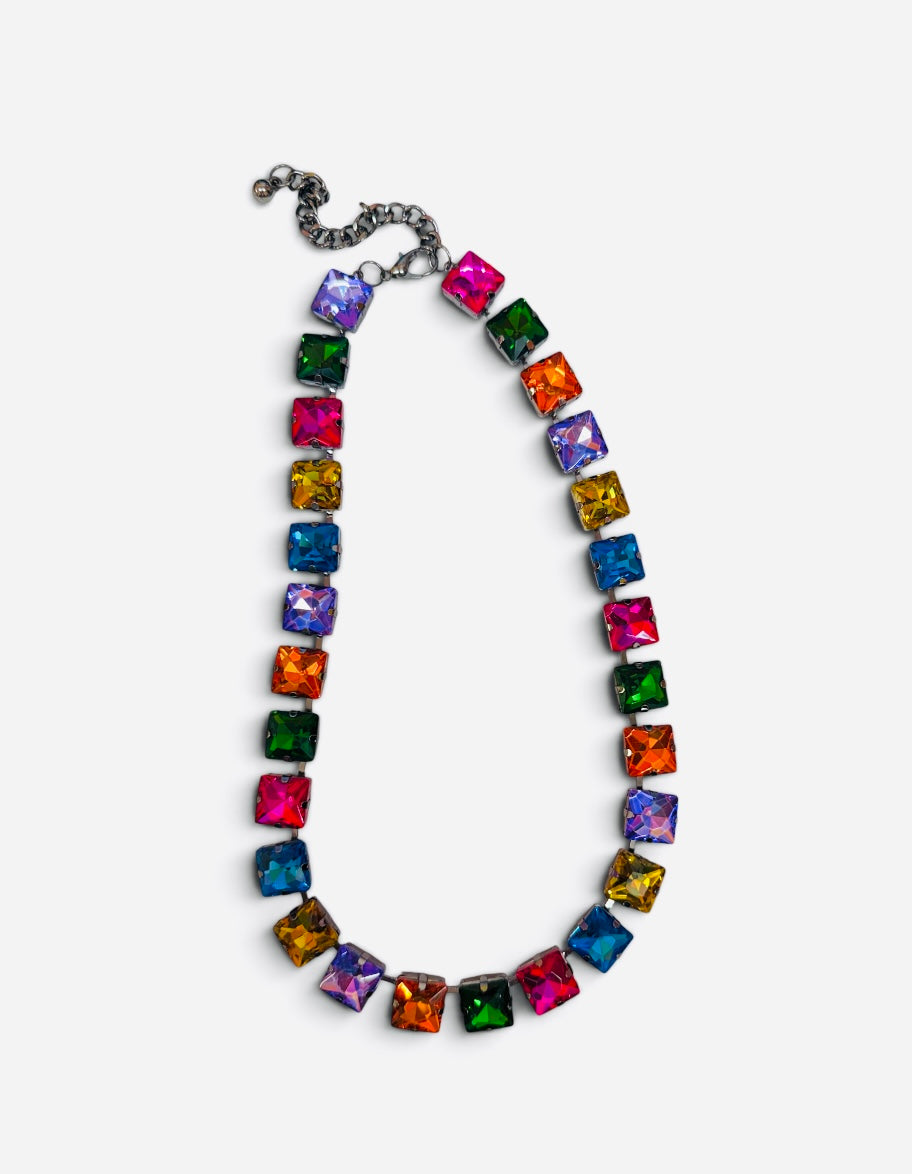 Multicolor necklace with oversized faceted crystals in pink, orange, yellow, green, blue, and purple.