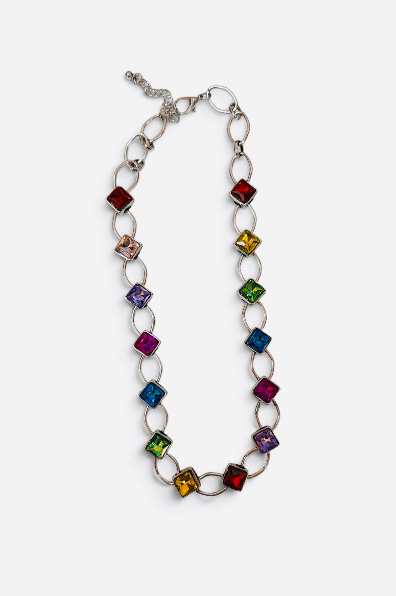 Silver-tone chain necklace with multicolor square crystal accents.