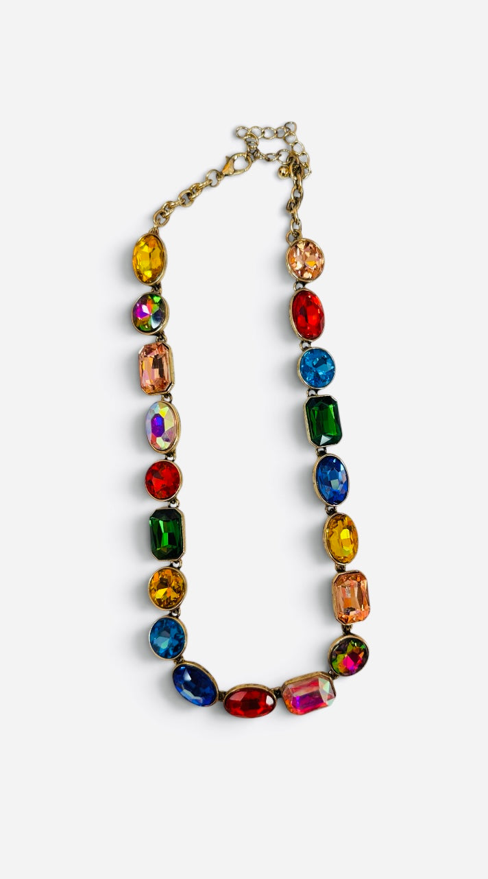 Multicolor jewel-tone crystal necklace with antique gold settings.