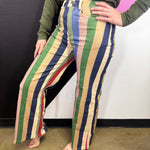 Multicolor wide leg pants with red, blue, green, pink and cream vertical stripes.