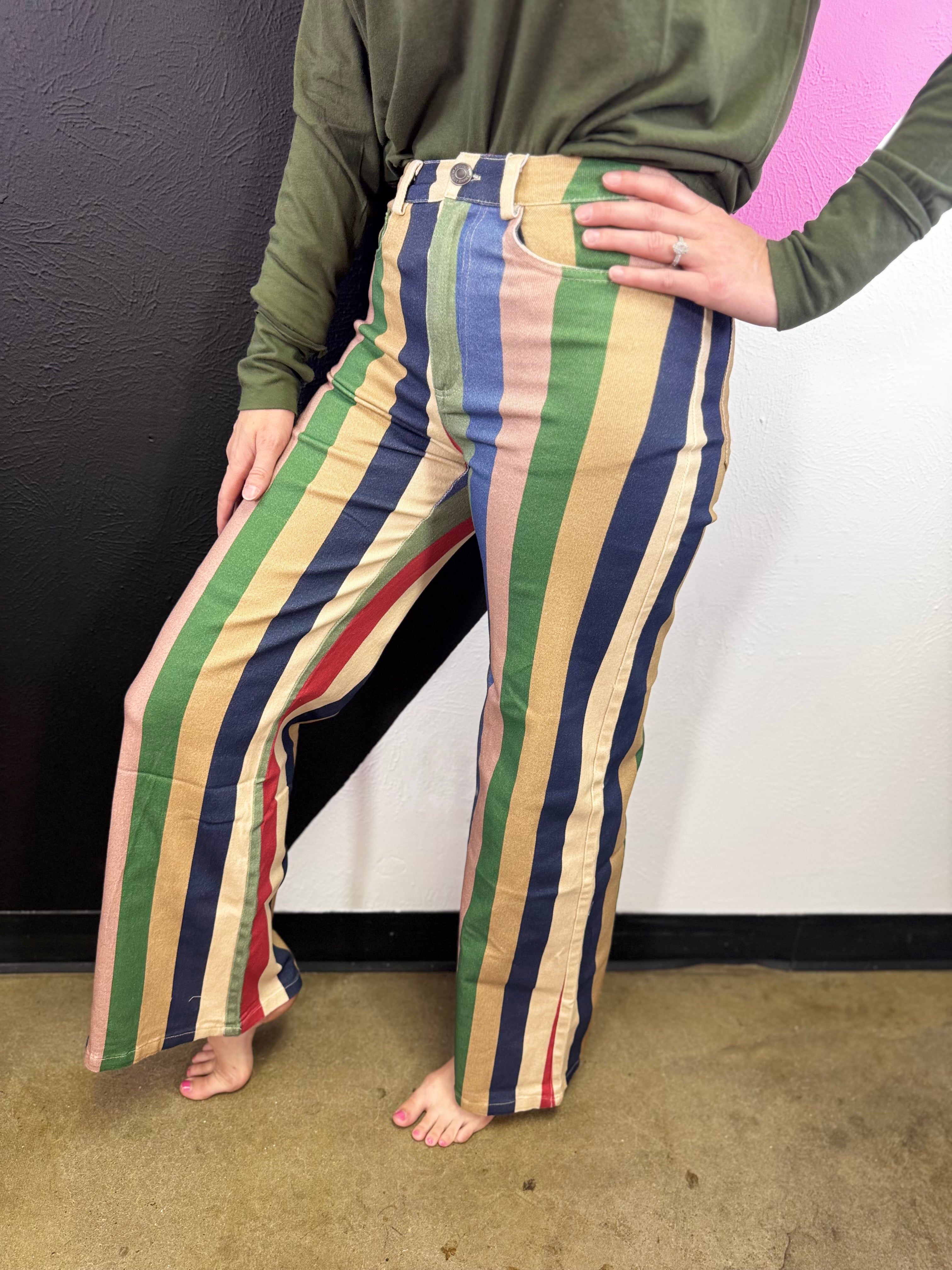 Multicolor wide leg pants with red, blue, green, pink and cream vertical stripes.