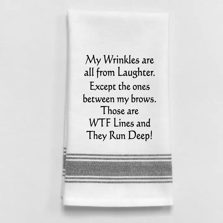 Funny cotton tea towel with wrinkles quote and humorous kitchen design.