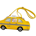 Bright yellow NYC taxi crossbody bag with checkerboard details, wheels, and iridescent windows