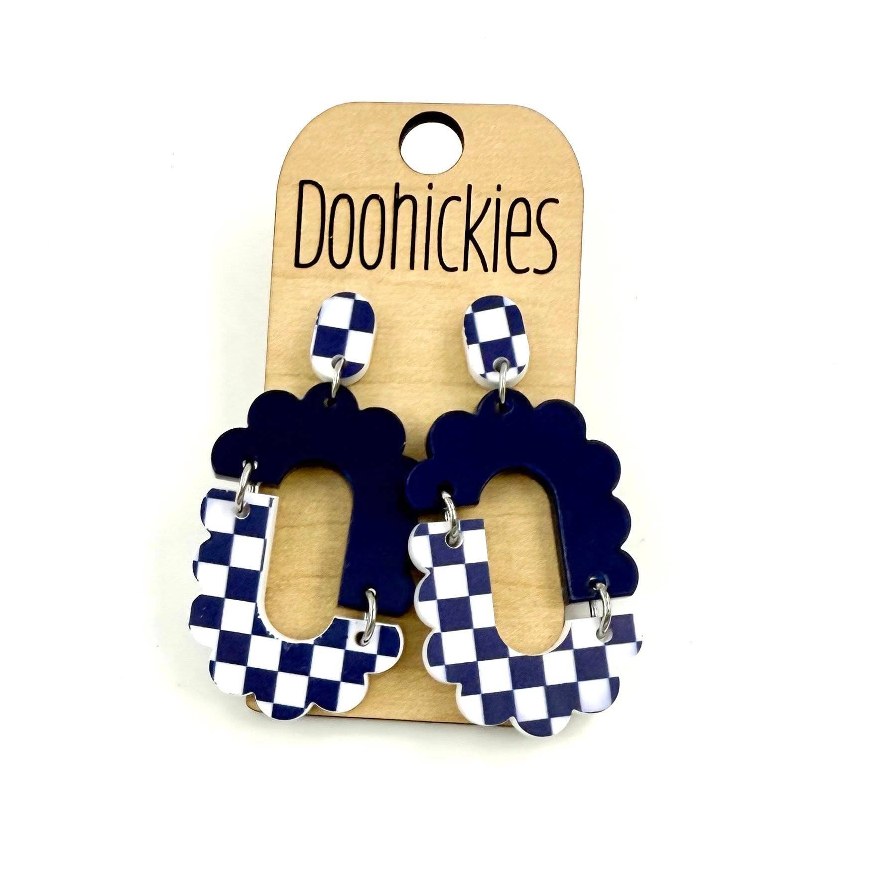 Navy blue checkered acrylic dangle earrings with hypoallergenic stainless steel settings.