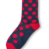 Navy polka dot socks with red heel and toe accents.