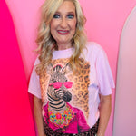 Neon Blingy Zebra Tee on pastel pink shirt with zebra in suit, leopard background, and neon rhinestone details.