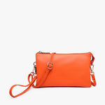 Neon orange vegan leather crossbody bag with multiple compartments and adjustable strap