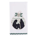 Embroidered nativity tea towel featuring vintage sheet music background in soft neutral holiday tones.