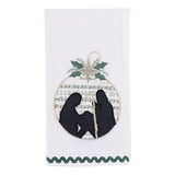 Embroidered nativity tea towel featuring vintage sheet music background in soft neutral holiday tones.