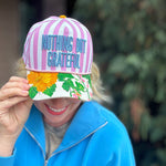 Purple striped baseball hat with floral bill and grateful embroidered message.