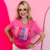 Pink nurse tee with colorful polka dot “NURSE” lettering design