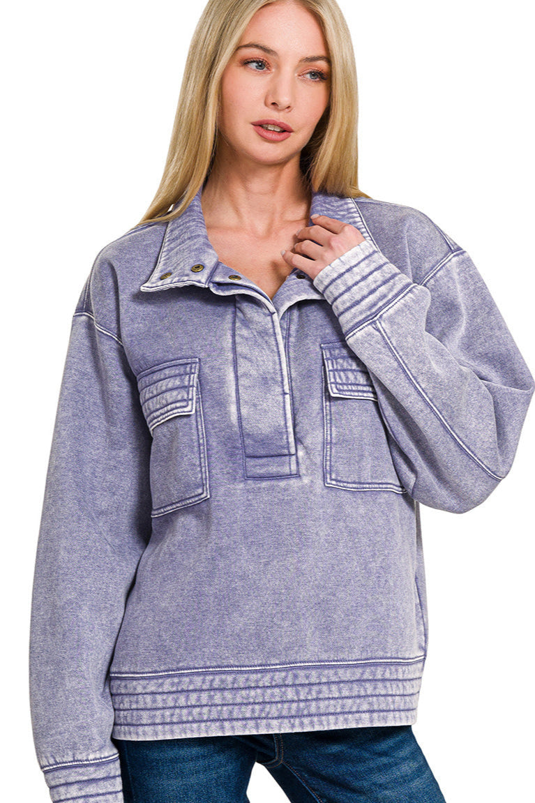 Marlin acid-washed half-snap fleece sweatshirt with button front and relaxed fit.