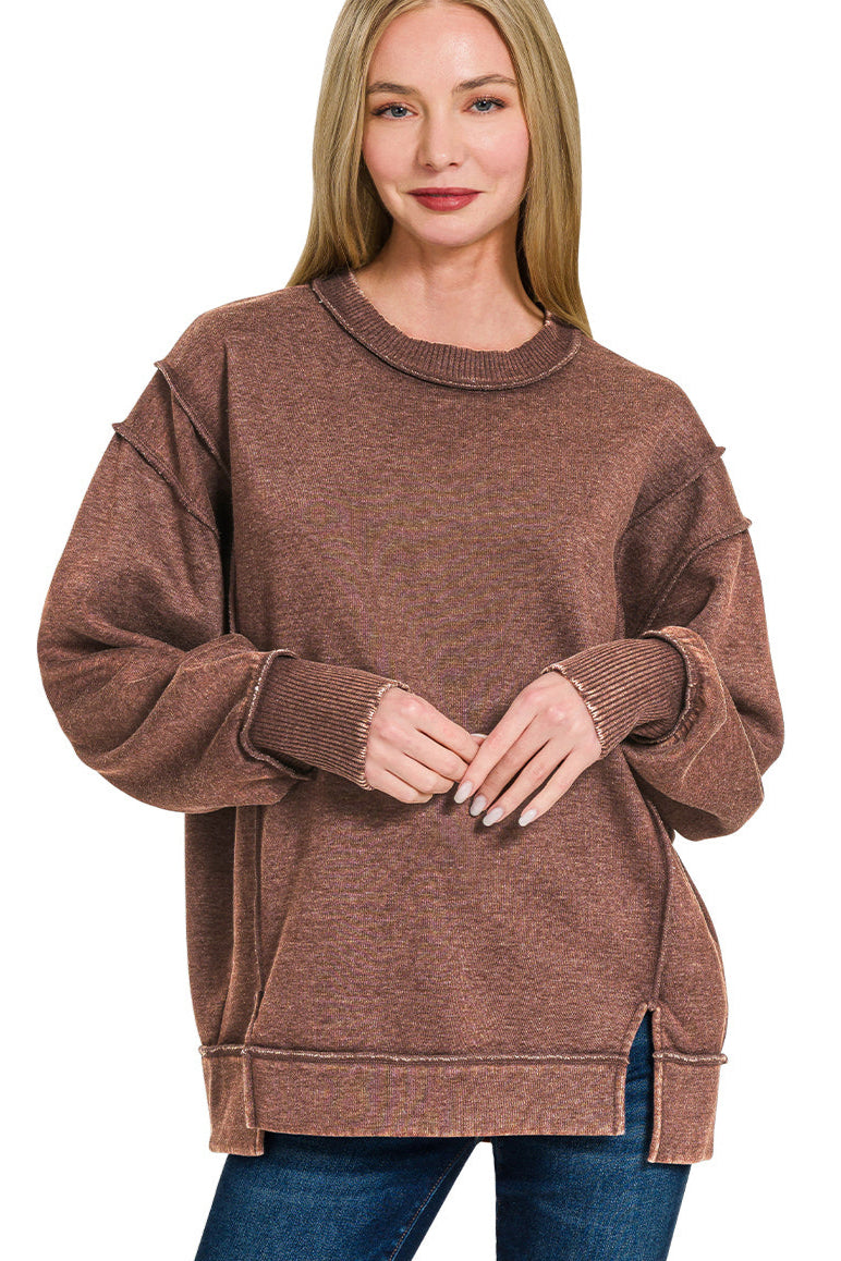 Mahogany acid wash fleece sweatshirt with exposed seams and side slit.