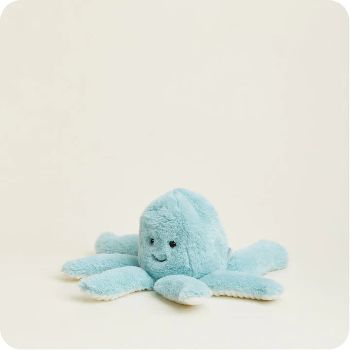 A soft, plush octopus toy with friendly embroidered eyes and eight curly tentacles, designed to be microwavable.