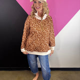 Oh Deer quarter zip pullover with woodland print, contrast trim, and side-slit hem.