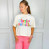 Ivory cropped graphic tee with colorful Oopsie Daisies lettering and retro floral design