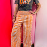 Orange and white gingham wide leg pants with a smocked waistband.