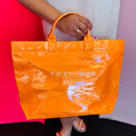 Bright orange tote bag with large capacity and structured durable everyday design