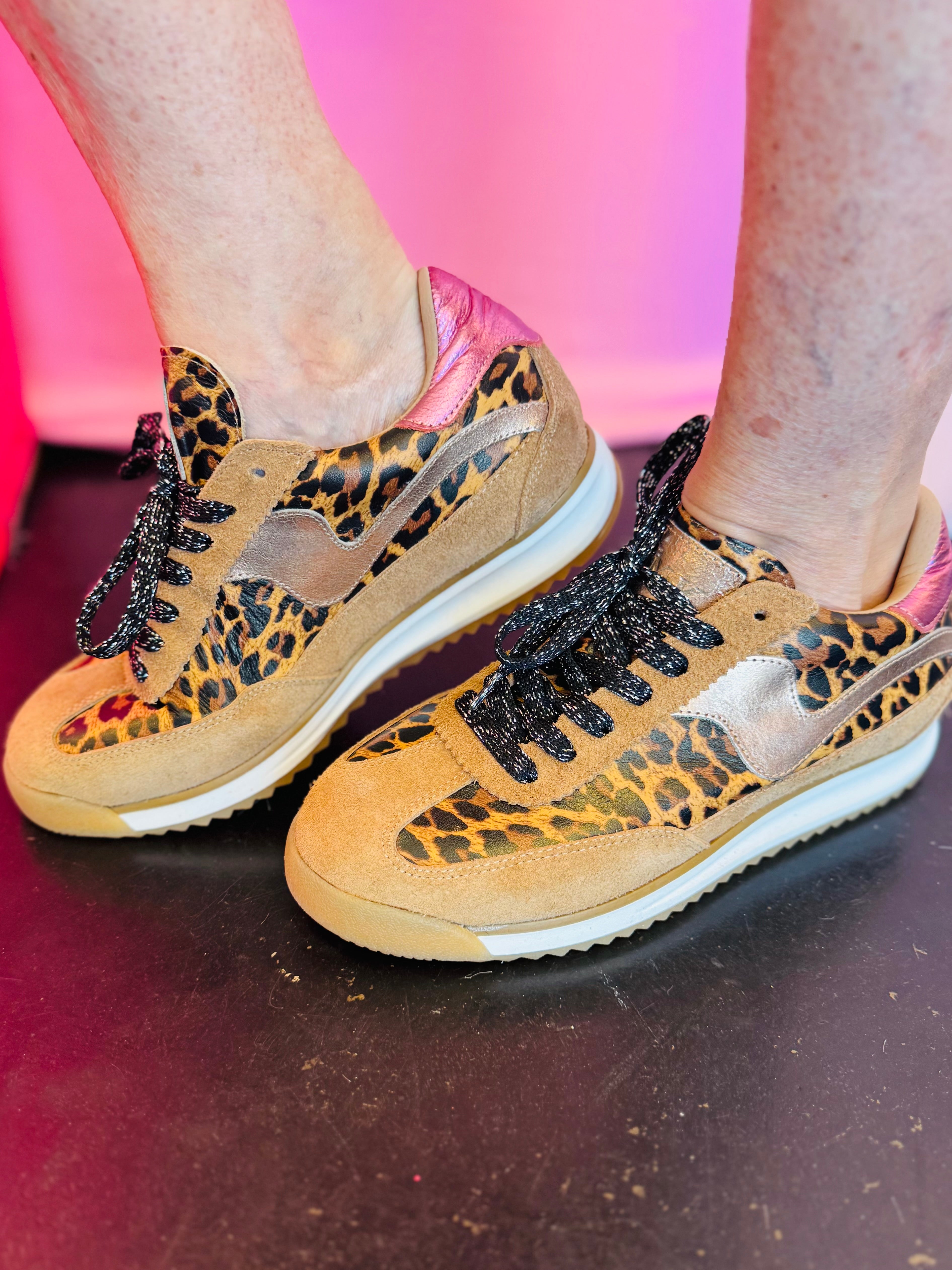Leopard print sneakers with suede panels metallic accents and black laces retro style