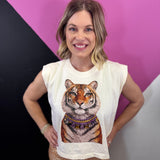 Cream sleeveless tiger muscle tee with layered sparkling jeweled necklace details.