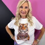 White tiger tee with layered jeweled necklace featuring purple and gold stones.