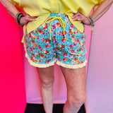 Colorful floral shorts with striped ruffle detail and elastic drawstring waistband