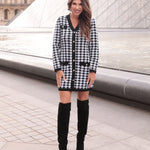 Jess Lea Houndstooth sweater dress with gold buttons, v-neckline, black trim, and front pockets.