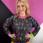 Colorful Halloween skeleton print pullover with contrast ribbed neckline, cuffs and hem.