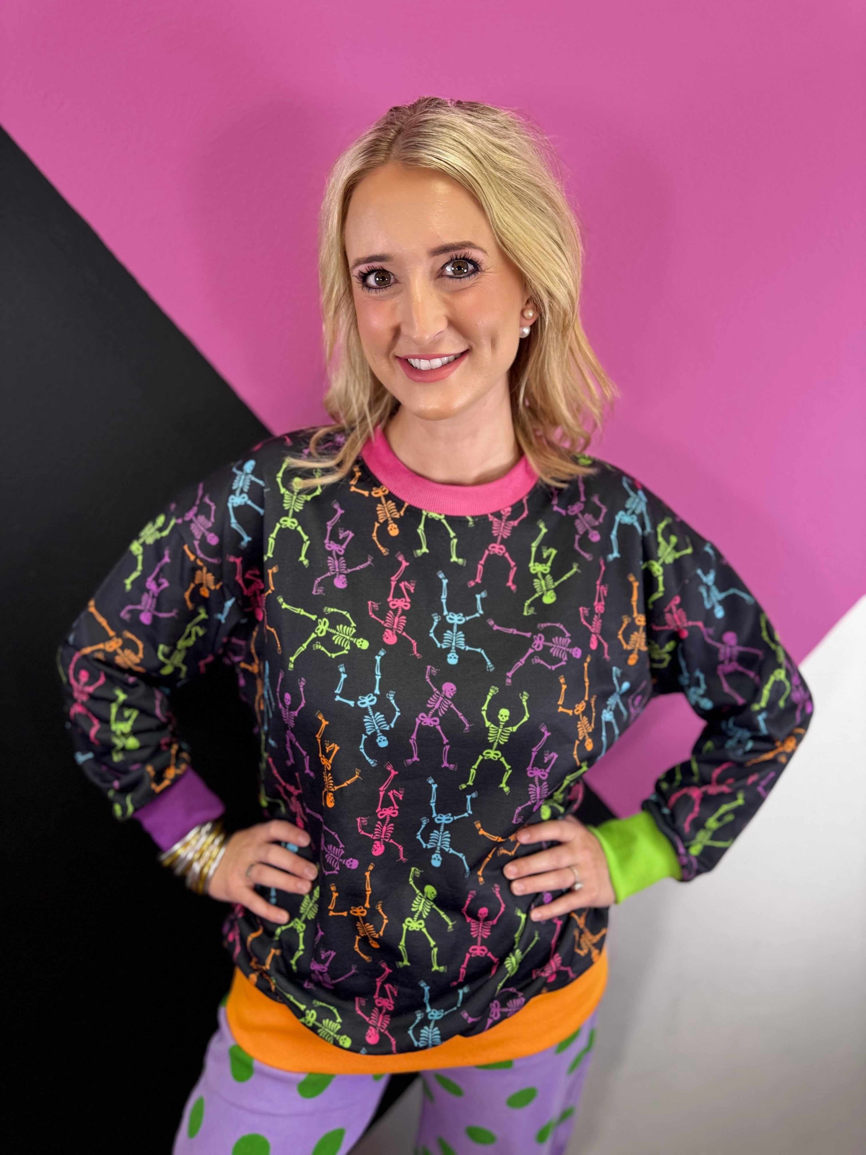 Colorful Halloween skeleton print pullover with contrast ribbed neckline, cuffs and hem.