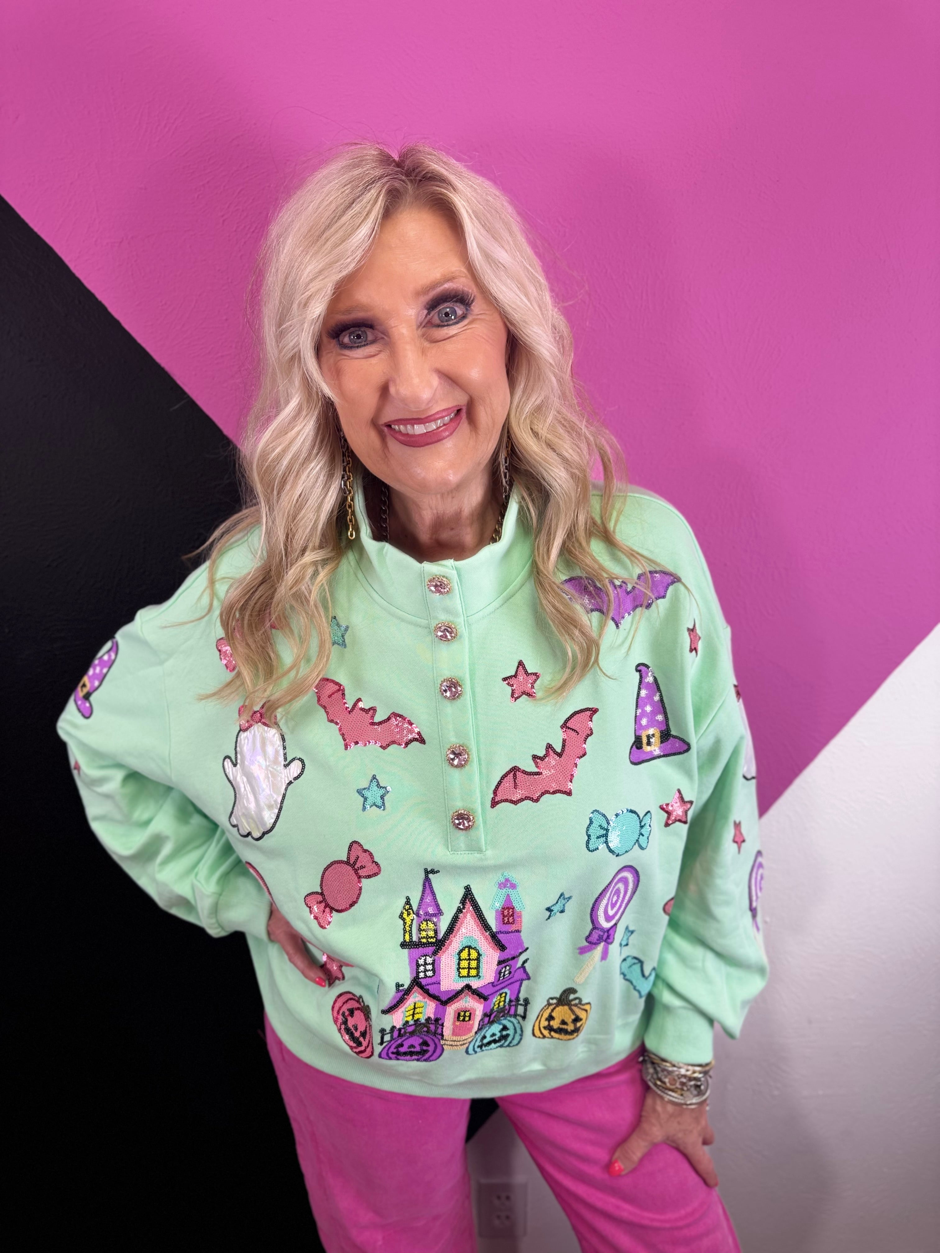 Mint Halloween pullover with colorful pumpkins, bats, candy, witch hats, sequins, and gemstone buttons.