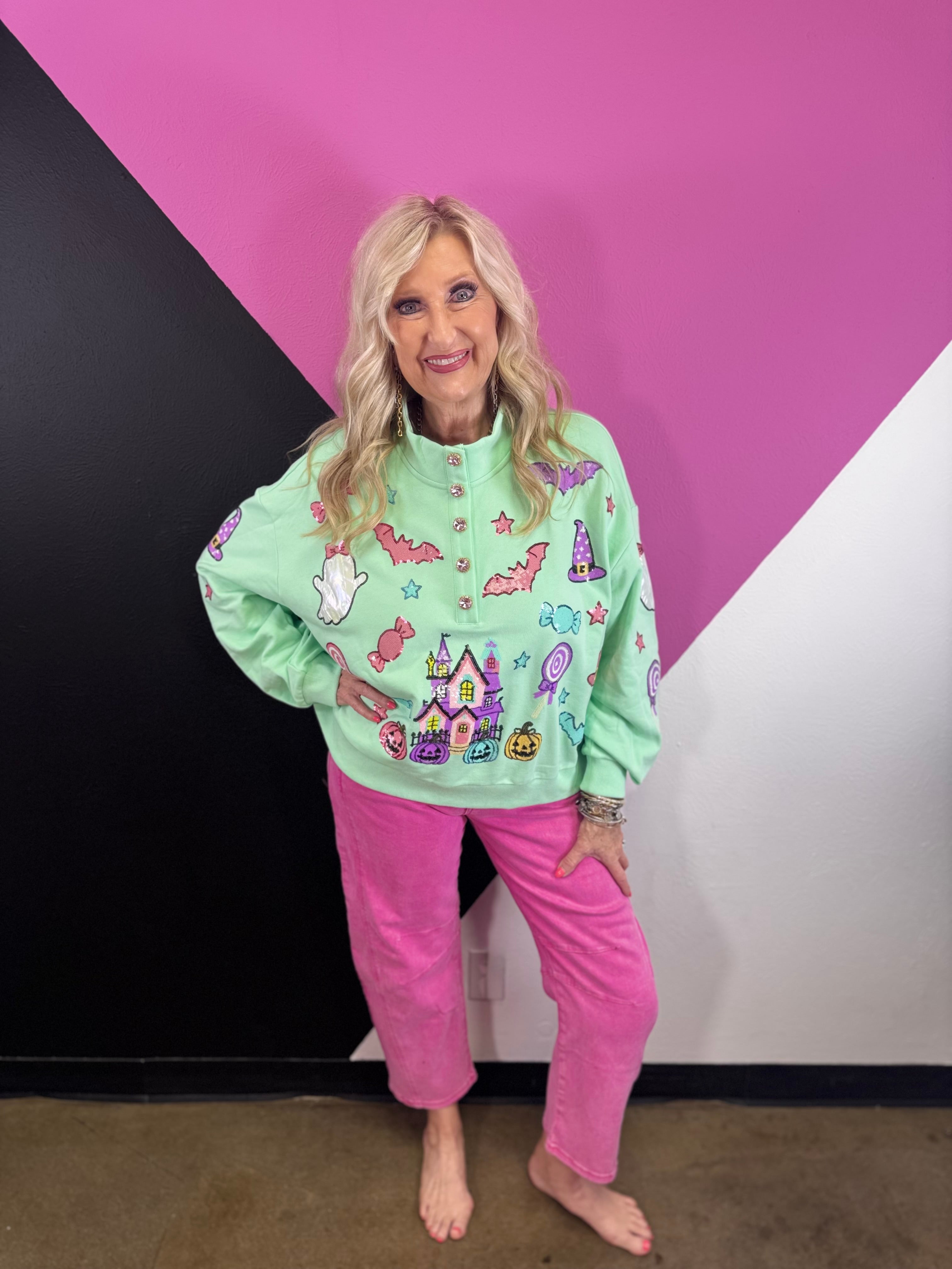 Mint Halloween pullover with colorful pumpkins, bats, candy, witch hats, sequins, and gemstone buttons.
