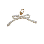 Pearl bow scarf charm with clasp closure and elegant feminine design