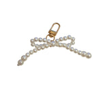 Pearl bow scarf charm with clasp closure and elegant feminine design