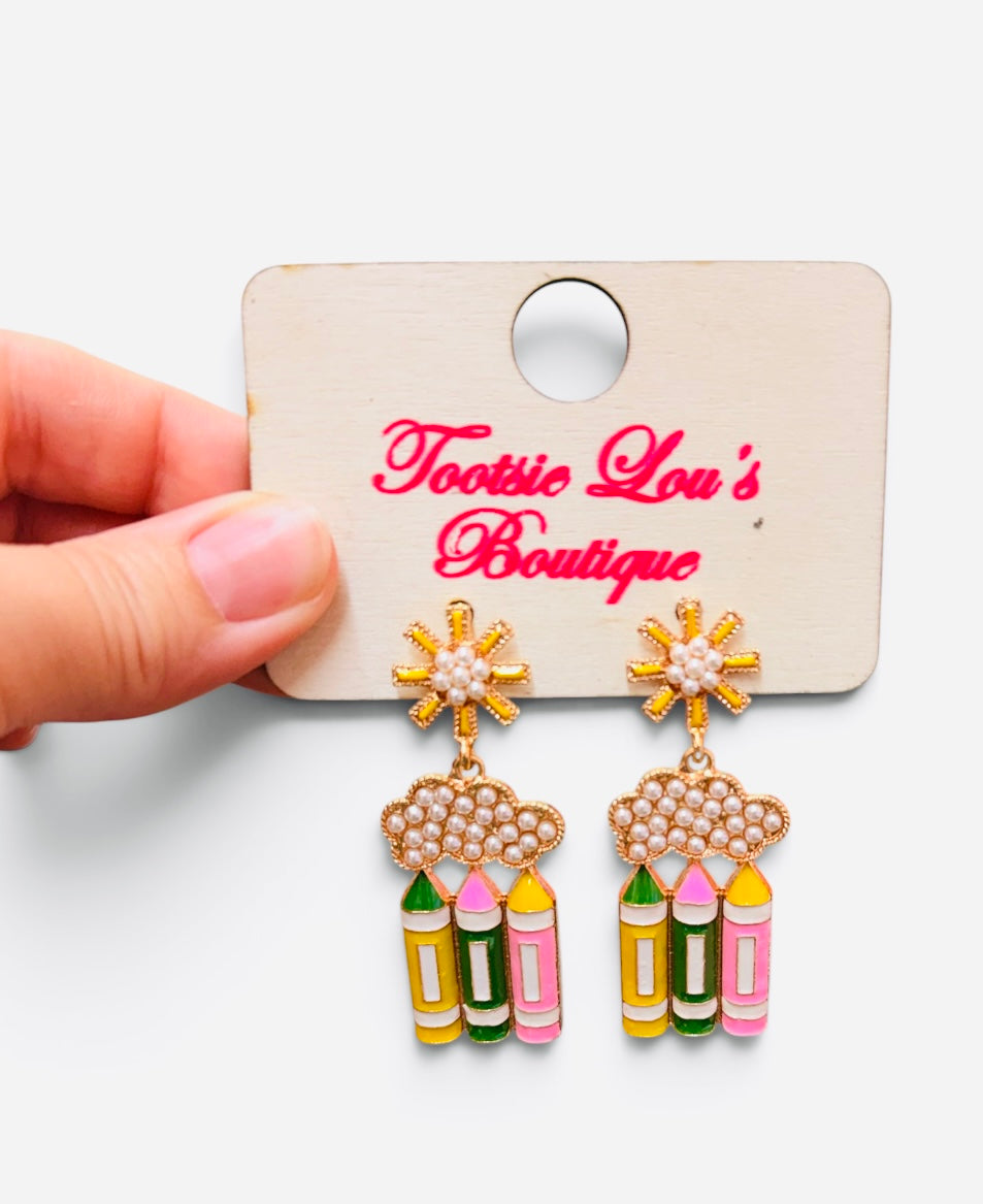 Pearl cloud earrings with dangling yellow, green, and pink pencils and floral studs.