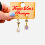 Pearl and crystal mismatch earrings with teardrop pearl and cascading stones