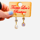 Pearl and crystal mismatch earrings with teardrop pearl and cascading stones