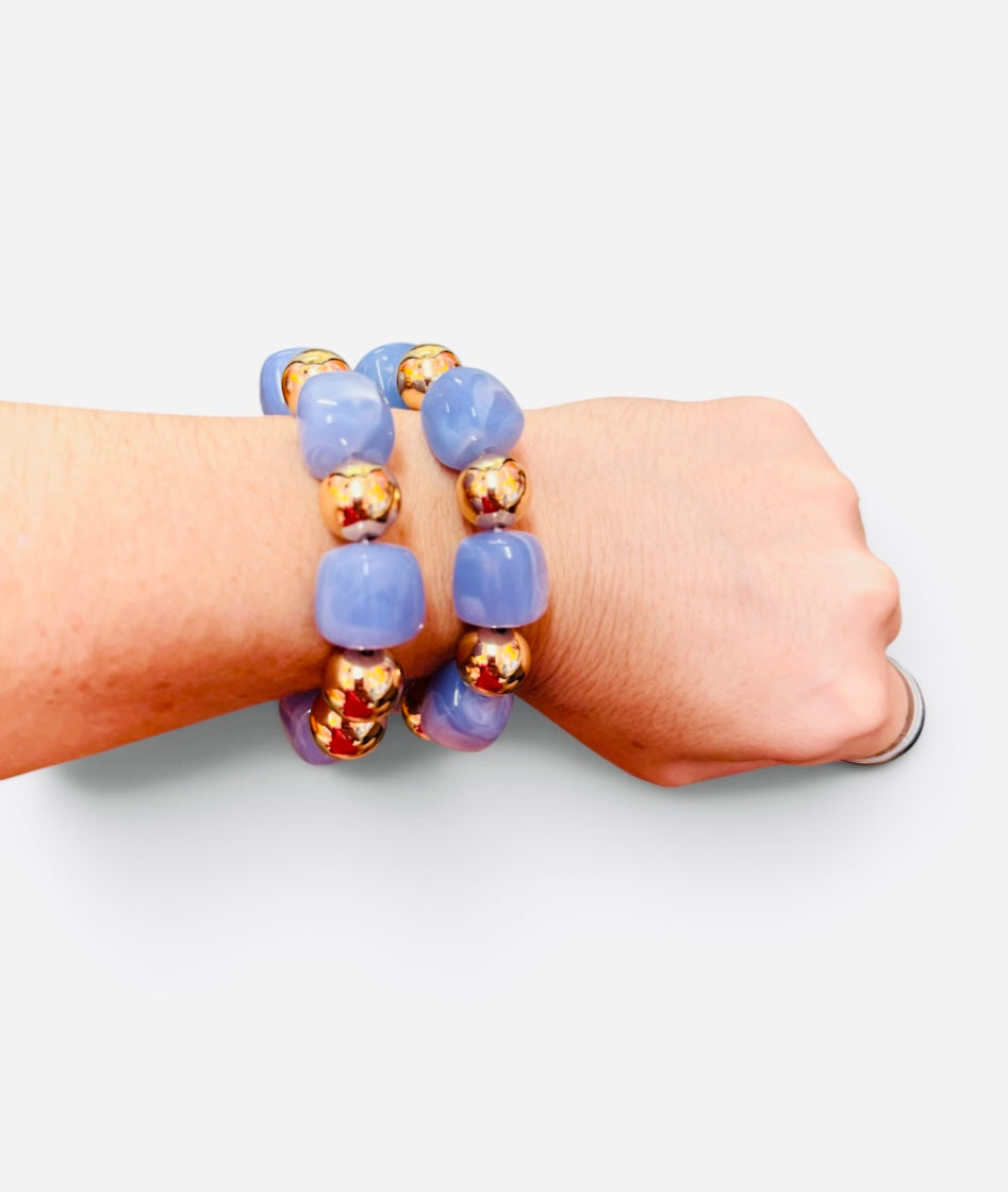 Periwinkle blue bubble bracelet stack with polished gold-tone beads and stretch fit.