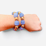 Periwinkle blue bubble bracelet stack with polished gold-tone beads and stretch fit.