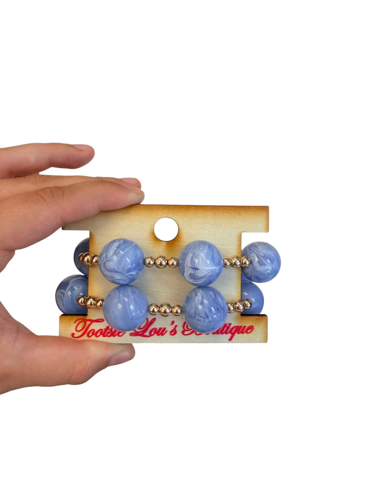 Periwinkle marbled bubble bracelet stack with oversized beads and gold spacers.