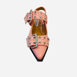 Pink pointed-toe flats with bold silver double buckle straps and a slingback backstrap, combining vibrant color with edgy charm.