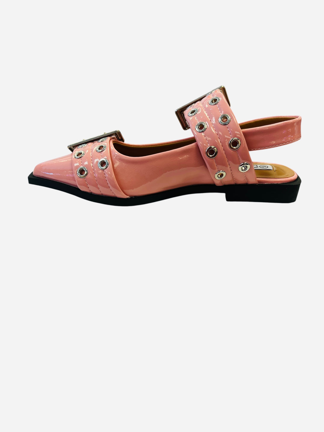 Pink pointed-toe flats with bold silver double buckle straps and a slingback backstrap, combining vibrant color with edgy charm.