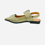 Olive pointed-toe flats with bold silver double buckle straps and a slingback backstrap, combining vibrant color with edgy charm.