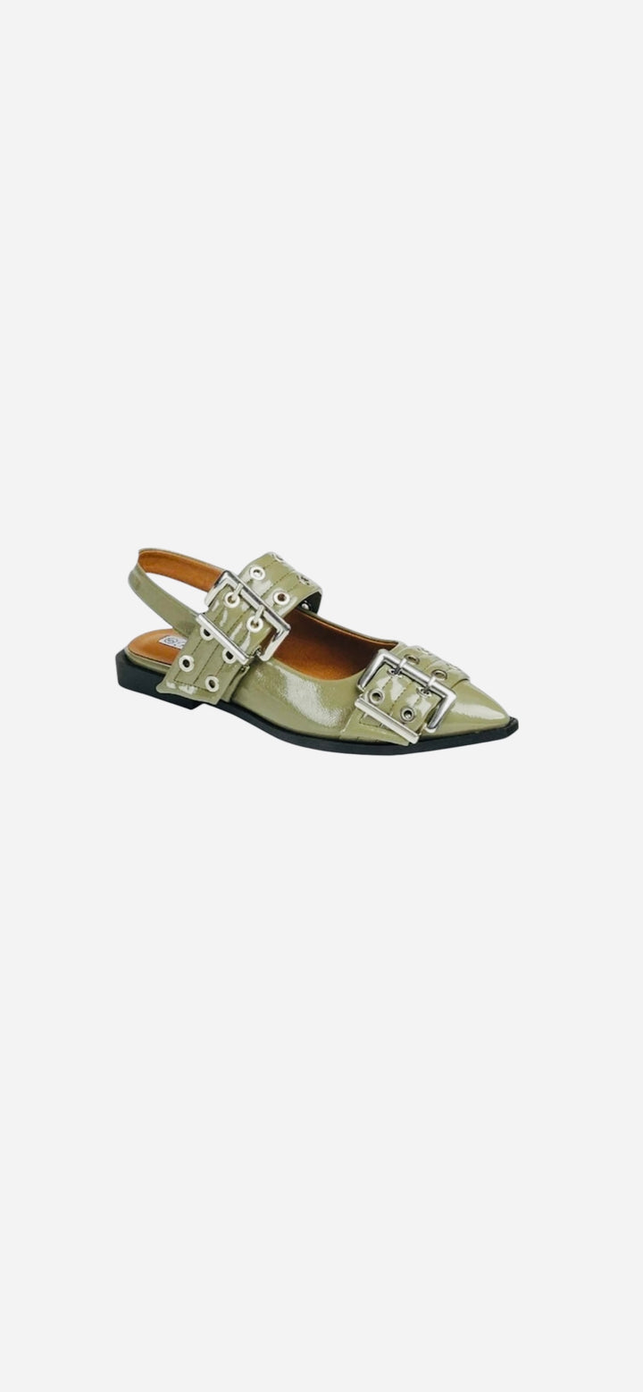 Olive pointed-toe flats with bold silver double buckle straps and a slingback backstrap, combining vibrant color with edgy charm.