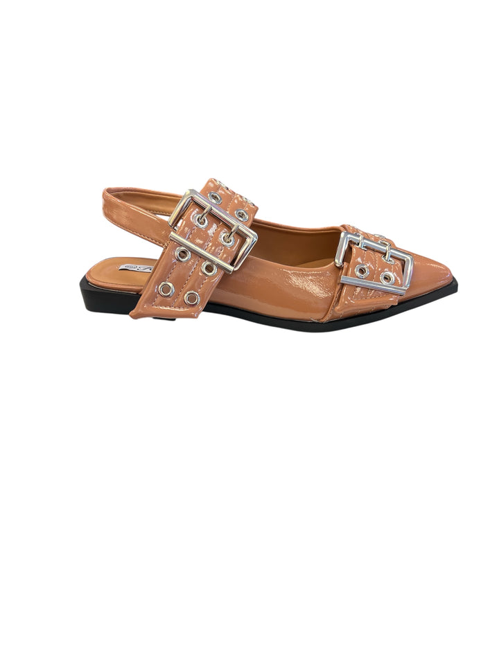 Tan pointed-toe flats with bold silver double buckle straps and a slingback backstrap, combining vibrant color with edgy charm.