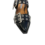 Black pointed-toe flats with bold silver double buckle straps and a slingback backstrap, combining vibrant color with edgy charm.
