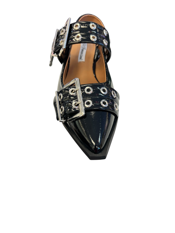 Black pointed-toe flats with bold silver double buckle straps and a slingback backstrap, combining vibrant color with edgy charm.